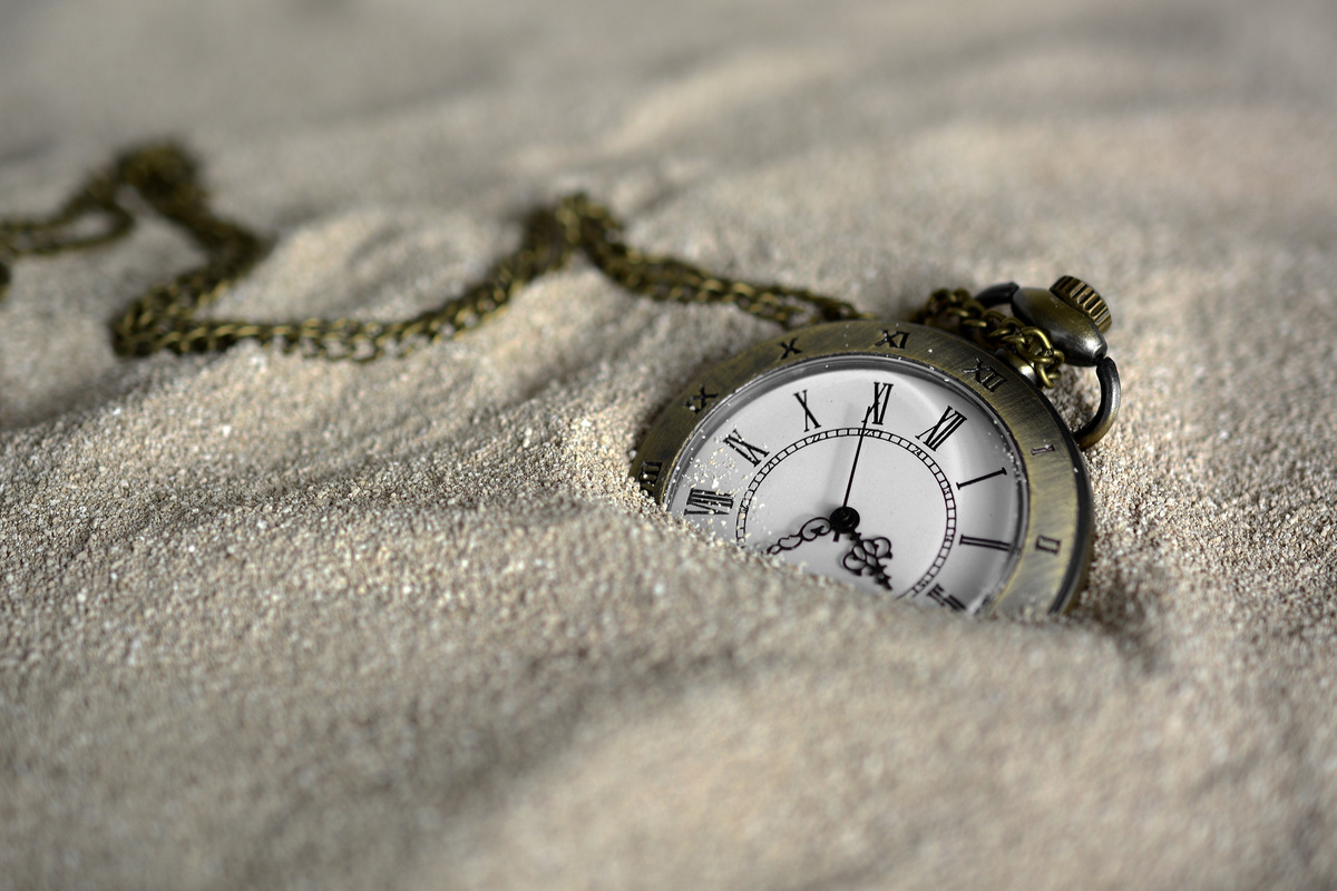 Old Pocket Watch in the Sand